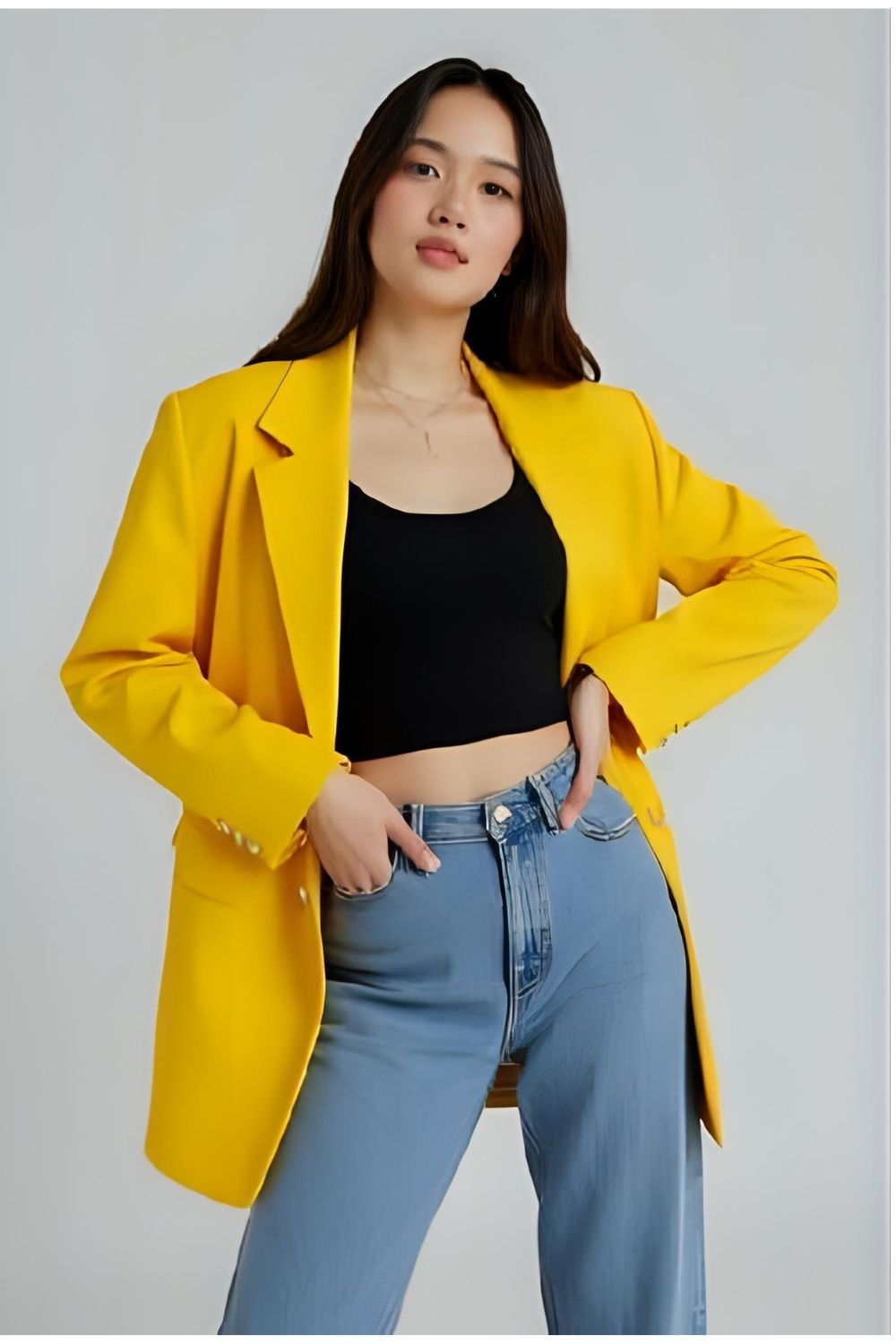 Smart-Casual Statement: Blue Jeans, Black Crop Top, and Yellow Blazer