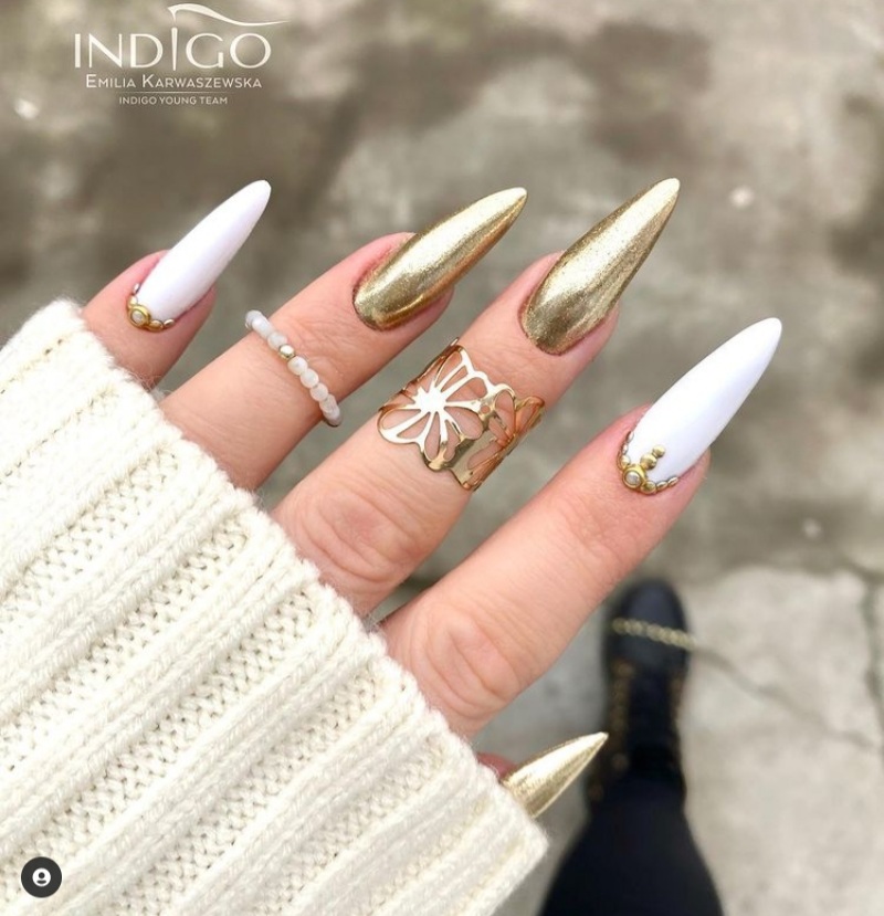 white and gold accent nails