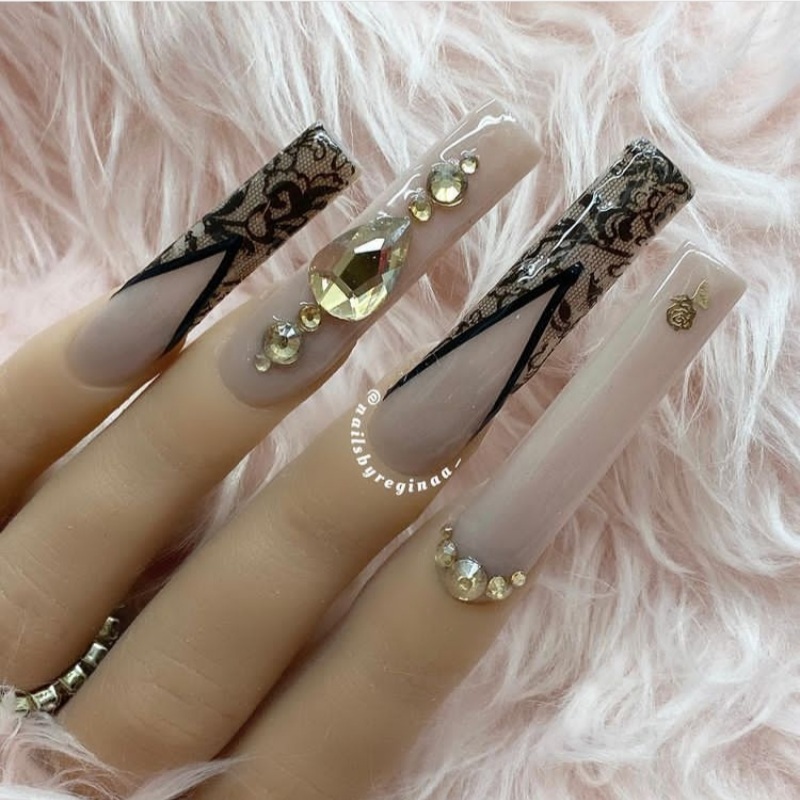 Lace nails design decorated with rhinestones.