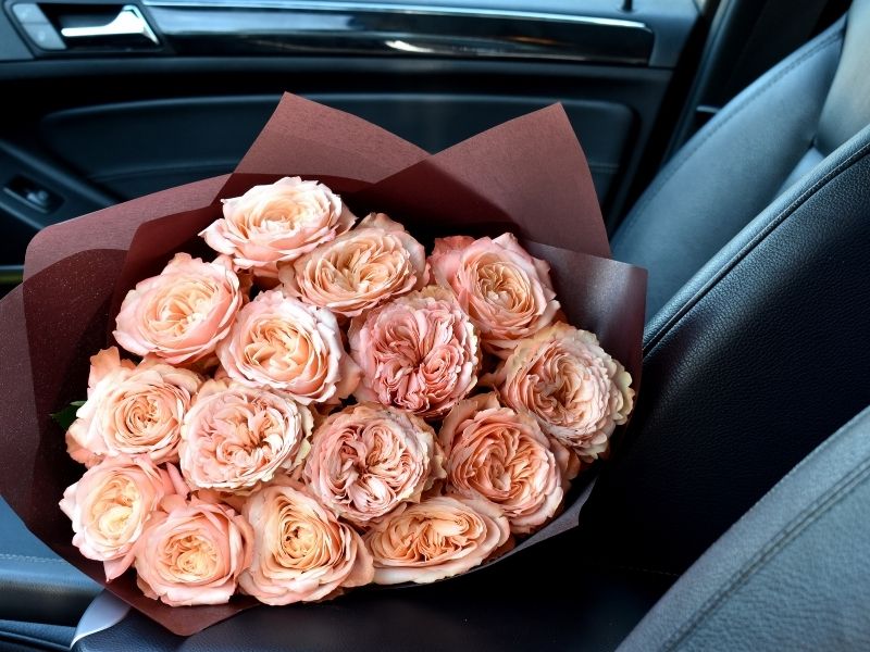 roses on a car seat for flower delivery service