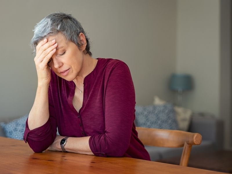 stressed older woman at home